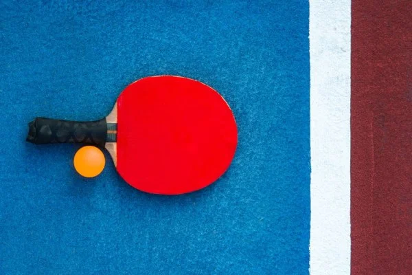 table tennis racket and ball